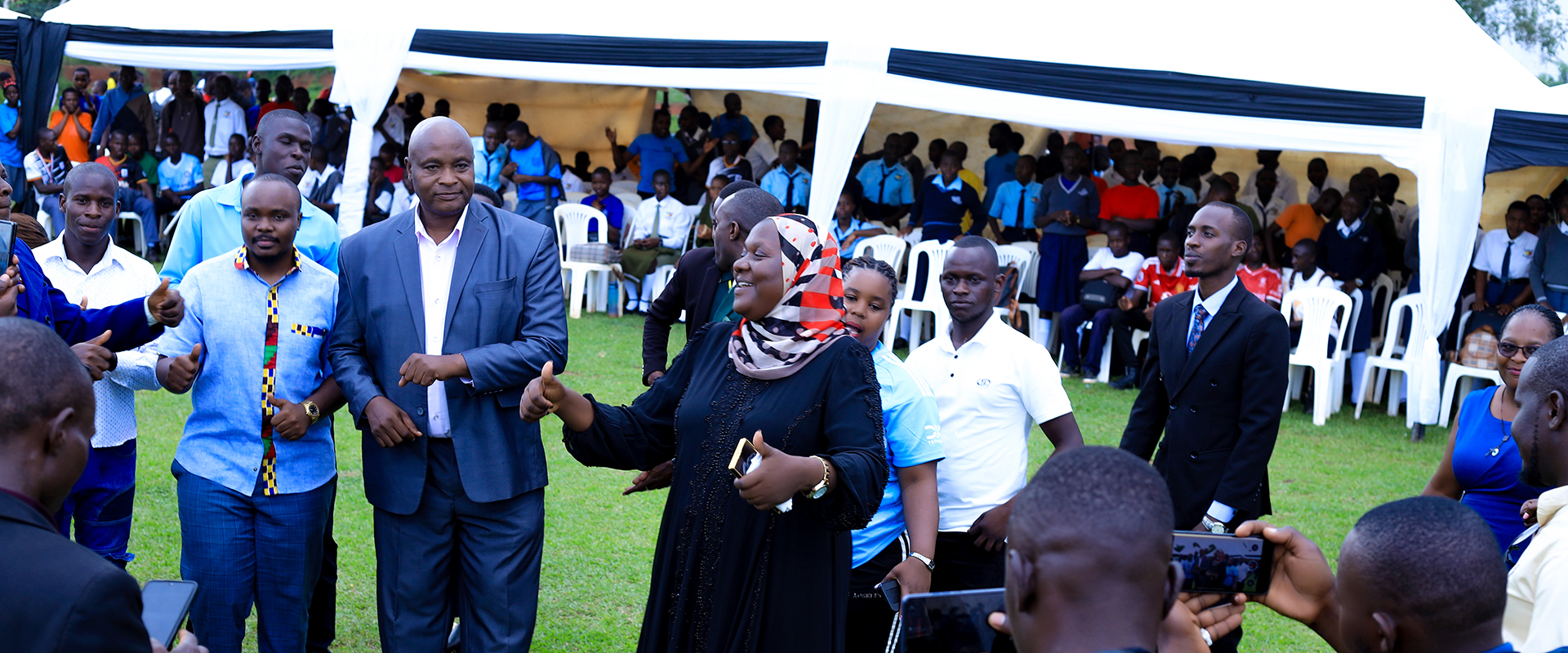 RDC Fatumah Ndisaba and Hon Francis Lukooya Mukoome while at Ndwaddemutwe seed school